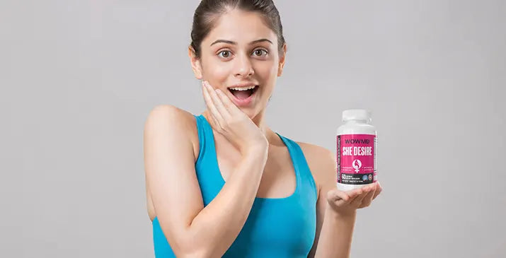 Woman holding WOWMD She Desire bottle — Best Female Libido Enhancement Supplements